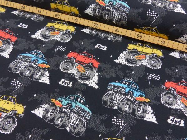 Baumwolljersey mit Monstertrucks auf Schwarz